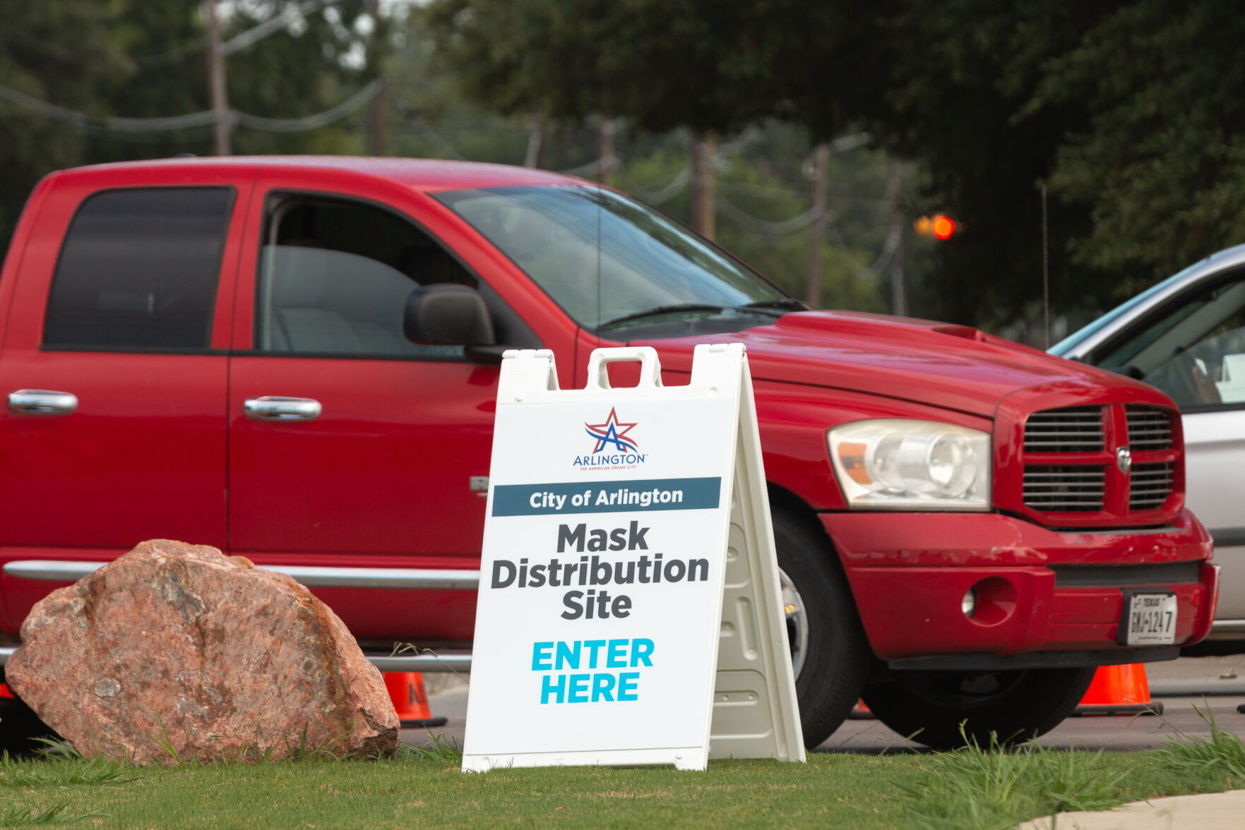Photos: Cars line up for over three miles at Arlington face mask distribution
